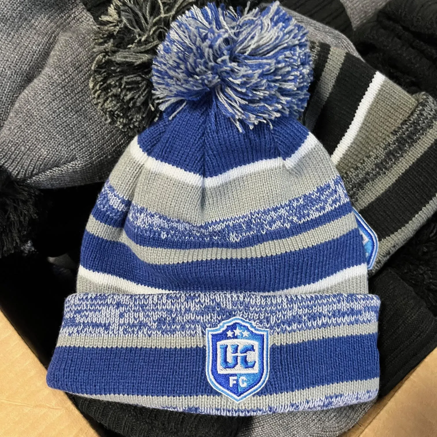 UCFC New Era Blue Stripe Pom Beanie